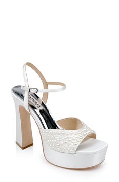 Sparkling embellishments amplify the elegant style of this special-occasion-ready platform sandal. 5" heel; 1 1/2" platform Adjustable ankle strap with buckle closure; hidden elastic inset Cushioned footbed Textile upper/synthetic lining/leather sole Imported White Platform Heels, Diamond Fashion Jewelry, Jewel Badgley Mischka, Flat Booties, Platform Block Heels, Platform Stilettos, Heeled Sandal, Diamond Fashion, Ankle Straps