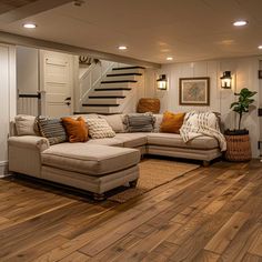 a living room filled with furniture and wooden floors