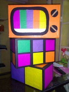 a tv made out of colored blocks on a table