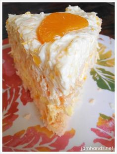 a piece of cake with orange jelly on top