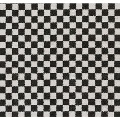 a black and white checkered rug is shown