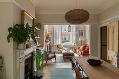 a living room filled with furniture and a fire place