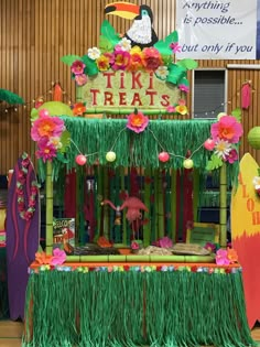 a tiki bar decorated with grass and flowers