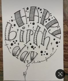 a birthday card with the words happy birthday written in black and white ink on paper