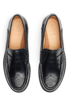 Wingtip styling elevates the look of a classic penny loafer shaped from burnished Italian leather. Leather upper, lining and sole Imported Black Penny Loafers Women, Classic Cap Toe Tassel Loafers With Brogue Detailing, Classic Cap Toe Loafers With Brogue Detailing, Classic Wingtip Loafers With Leather Lining, Classic Wingtip Tassel Loafers With Leather Lining, Masculine Brogue Loafers For Semi-formal Occasions, Classic Wingtip Loafers With Rubber Sole, Masculine Semi-formal Loafers With Brogue Detailing, Classic Wingtip Loafers For Semi-formal Occasions