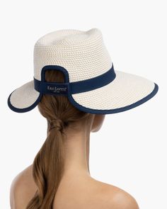 The Sun Crest visor is a stylish hybrid of the classic high-crowned fedora hat and a practical visor with a generous 4-inch brim. This fashionable Squishee® straw hat is trimmed with grosgrain ribbon for a chic, polished finish. You'll turn heads wherever you go this summer. Our revolutionary Squishee material is a synthetic straw fabric constructed from partially recycled plastics. This environmentally friendly material resembles genuine raffia straw, but it offers several practical advantages Straw Visor, Art Costume, Visor Hat, Women's Headwear, Costume Institute, Visor Hats, Summer Look, Fedora Hat, Vanity Fair