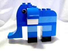 an elephant made out of legos on a white background