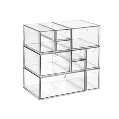 four clear drawers are stacked on top of each other