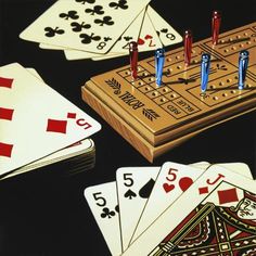 playing cards and dices on a table with black background, including one in the middle