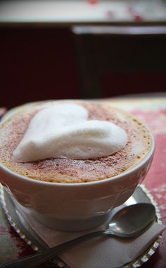 a cup of hot chocolate with cream on top