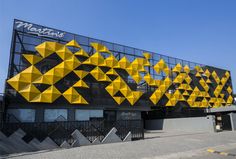 a building that has yellow and black designs on it