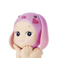 a small figurine with a pink hat on top of it's head