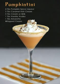 pumpkin spice liqueur in a martini glass with whipped cream and caramel garnish