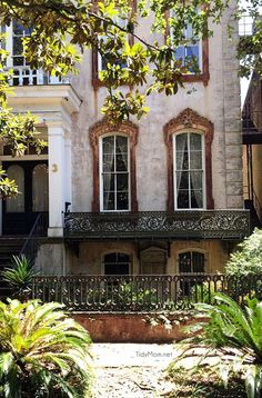 an old building with many windows and balconies