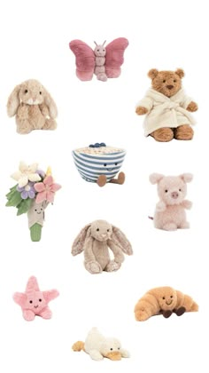 stuffed animals are arranged in the shape of an angel, rabbit, and flower arrangement