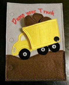 a yellow dump truck with two brown bears on it's back and the words dump don't touch