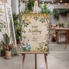 an easel with a wedding sign on it