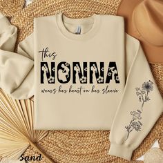 Gift for Nonna I Wear My Heart On My Sleeve Nonna Shirt Custom Childrens Name on Sleeve New Nonna Sweatshirt Birth Month Flower Grandma Gift SHIRT ➡️BELLA + CANVAS 3001 ➡️ Sizes: Available up to 3XL. SEE SIZE CHART in the photo section of this listing. ➡️ Printed And Shipped From Canada / USA ➡️ Printing Method: DTG ➡️ Care: Machine Wash Cold SWEATSHIRT ➡️GILDAN 18000 ➡️ Sizes: Available up to 5XL. SEE SIZE CHART in the photo section of this listing. ➡️ Printed And Shipped From Canada / USA ➡️ Printing Method: DTG ➡️ Care: Machine Wash Cold HOODIE ➡️GILDAN 18500 ➡️ Sizes: Available up to 5XL. SEE SIZE CHART in the photo section of this listing. ➡️ Printed And Shipped From Canada / USA ➡️ Printing Method: DTG ➡️ Care: Machine Wash Cold GENERAL POLICIES *️⃣ NO cancellations, returns, exchang Flower Grandma, Cold Sweatshirt, Heart On My Sleeve, Birth Month Flower, Grandma Gift, Birth Month Flowers, Trendy Shirts, Personalized Christmas Gifts, Birth Month