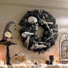 a wreath with skeletons and bones hanging on the wall