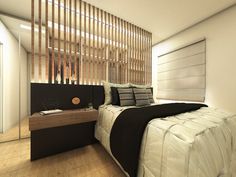 a large bed sitting in a bedroom next to a wooden slatted headboard