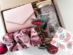 an open gift box filled with christmas items