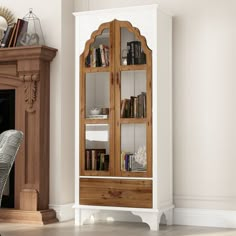 a wooden cabinet with glass doors next to a fireplace