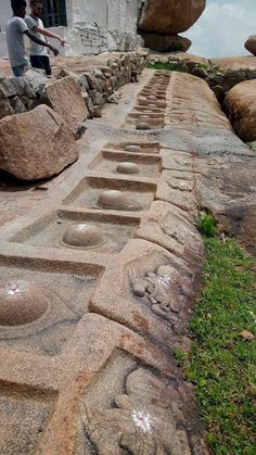 a man standing on top of a stone walkway