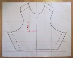 a drawing of a dress pattern is shown on a piece of paper that has been cut in half