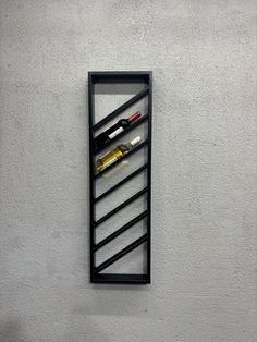 a wine rack mounted to the side of a wall