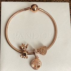 Authentic Pandora 14k Rose Gold-Plated Moments Snake Chain Bracelet With 3 Authentic Pandora Charms Bracelet Alone Is $225 From Pandora Website Charms Included: - Moose Charm - Heart Charm - Family Forever Dangle Charm. It Also Opens Like A Locket To Reveal The Message "Family Forever" (Please Review Pictures) Very Pretty Bracelet And Charm Rose Gold Set! One Of My Favorite Bracelet From Pandora. Great Pre-Loved Condition. Come With Original Pandora Box. Please Review All Photos. Bracelet Length Is 7” Rose Gold Pandora, Gold Pandora, Pandora Charms Bracelet, Pandora Gold, Family Forever, Snake Chain Bracelets, Charms Bracelet, Pandora Charm, Pretty Bracelets