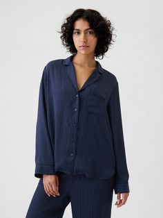 Soft satin pajama shirt.  Notch collar, button front.  Long sleeves.  Patch pocket at chest.  Certain styles have allover prints.  Fit: Over Blue Pjs, Button Up Pjs Pajama Set, Blue Satin Pajamas, Blue Button-up Sleepwear For Summer, Navy Blue Pajamas, Blue Button-up Sleepwear With Button Closure, Classic Pajamas, Satin Pajamas, Pajama Shirt