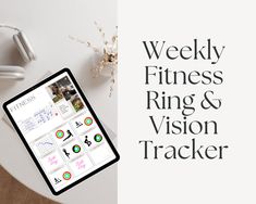 a tablet with the words weekly fitness ring and vision tracker on it