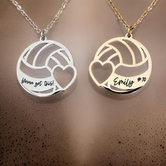 two necklaces that say, you're got this and smile to play volleyball