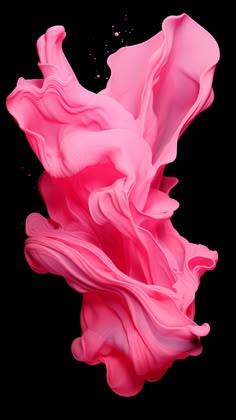 an abstract photo of pink fluid in the air