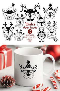 a coffee mug with reindeer faces on it next to candy canes and christmas decorations