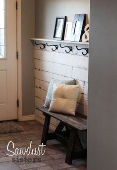 a bench sitting in front of a white door next to a window with the words sawdust sister's post on it