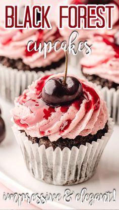 black forest cupcakes are topped with pink frosting and cherries on a white plate