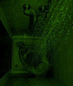 a green image of a person in the shower