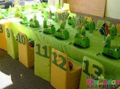 the table is set up with green and yellow decorations