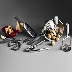 a group of kitchen utensils sitting on top of a table