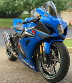 a blue motorcycle is parked on the street