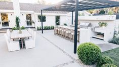 an outdoor kitchen and dining area is shown