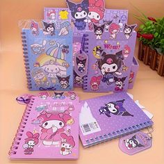 several notebooks with cartoon characters on them