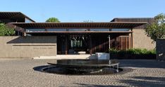 an outdoor courtyard with a fountain in the middle