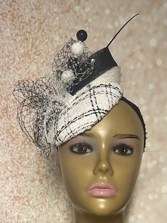 Black and White Tweed Fascinator Half Hat for Church Head Covering, Tea Party, Wedding and Other Special Occasions This black and white hat is trimmed with bows, veiling, rhinestone, a hat pin and black feather stem. The hat pin may vary. Measures approximately 5.9 inches in diameter. Available in 7 and 8 inches. Please DM for assistance. Hat affixes to head by hat string. Handmade Gifts for mom, sister, wife, or yourself. Love what you see, but would like it in a different color, shape or size? Please contact us by sending a message. We offer custom hats in a variety of styles. PLEASE NOTE All items for Free Shipping will be shipped via USPS First Class Mail. Return shipping costs are at the expense of the customer. Fitted Gatsby Style Hat Headpiece, Fitted Gatsby Hat Headpiece, Fitted Gatsby Style Mini Hat With Short Brim, Gatsby Style Fitted Fascinator Hat, Elegant Winter Fascinator With Curved Brim, Elegant Winter Party Top Hat, Elegant Adjustable Mini Hats For Winter, Elegant Winter Mini Hats Adjustable, Chic Fitted Fascinator For Party