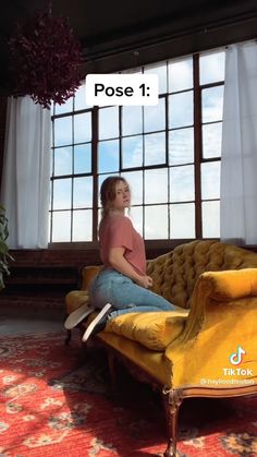 a woman sitting on top of a yellow couch in front of a window with the caption pose 1