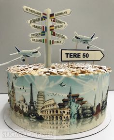 there is a cake that has been decorated with many different things on it, including an airplane