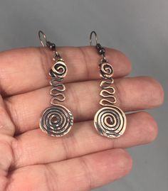 Get 20% off this item by joining my VIP group. Go to bit.ly/Eyespire-VIP Aged copper spiral Earrings with a Celtic flair. The dainty Spiral earrings were shaped and hammered by hand from pure copper wire and further enhanced with a black antique patina to add dimension. These earrings are lightweight and hypoallergenic. The earring wires are made from iron which is perfect for those with sensitive ears. You will definitely get compliments whenever you wear these charming earrings. Great for ever Metal Spiral Earrings With Ear Wire, Spiral Metal Earrings With Ear Wire, Hypoallergenic Spiral Metal Earrings, Bronze Spiral Earrings For Gifts, Adjustable Spiral Metal Earrings, Nickel-free Bronze Spiral Earrings, Spiral Metal Earrings, Copper Wire Earrings, Celtic Spiral