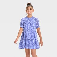 Update your kid's casualwear with this Short-Sleeve 'Heart' Woven Dress from Cat & Jack™. This dress is crafted from lightweight satin fabric with lining to lend comfortable all-day wear, and the behind-the-neck button closure makes dressing easy. Designed with a functional side pocket, this heart-printed dress features a ruff collar, smocked elbow sleeves and a tiered hem for sweet style. They can add sandals, slip-ons or sneakers to complete the look. Cat & Jack™: Designed for all children so Ruff Collar, Velour Dress, Periwinkle Blue, Kids Outfits Girls, Polyester Satin, Sweet Style, Woven Dress, Printed Dress, Girls Long Sleeve