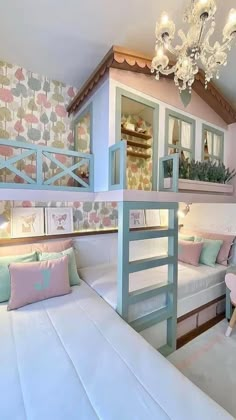 a bedroom with bunk beds and desks in it